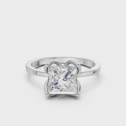 Softly rotating footage highlighting the light play across each facet and the ring’s lustrous white gold structure.
