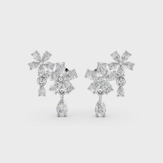 Short video of Floral Cascade Diamond Earrings in 18K white gold, featuring 3.20 ct lab-grown diamonds, rotating to showcase the cool tone and sparkling layered blossom design.