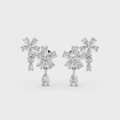 Short video of Floral Cascade Diamond Earrings in 18K white gold, featuring 3.20 ct lab-grown diamonds, rotating to showcase the cool tone and sparkling layered blossom design.