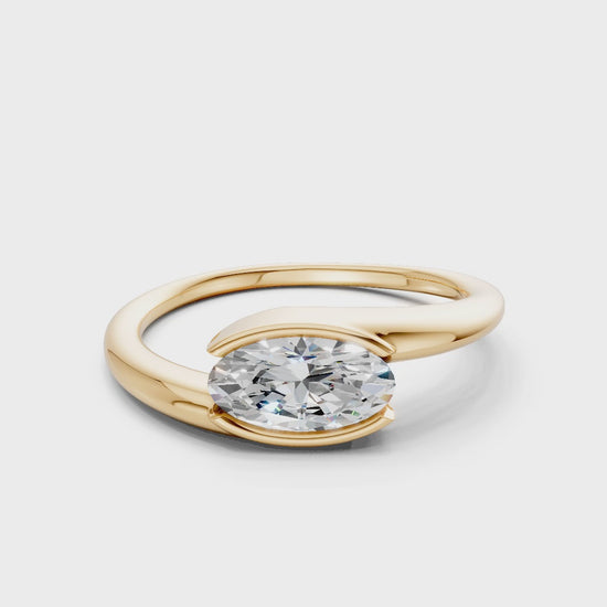 Rotating video showing the brilliance of the oval diamond and the polished finish of the yellow gold band in motion.