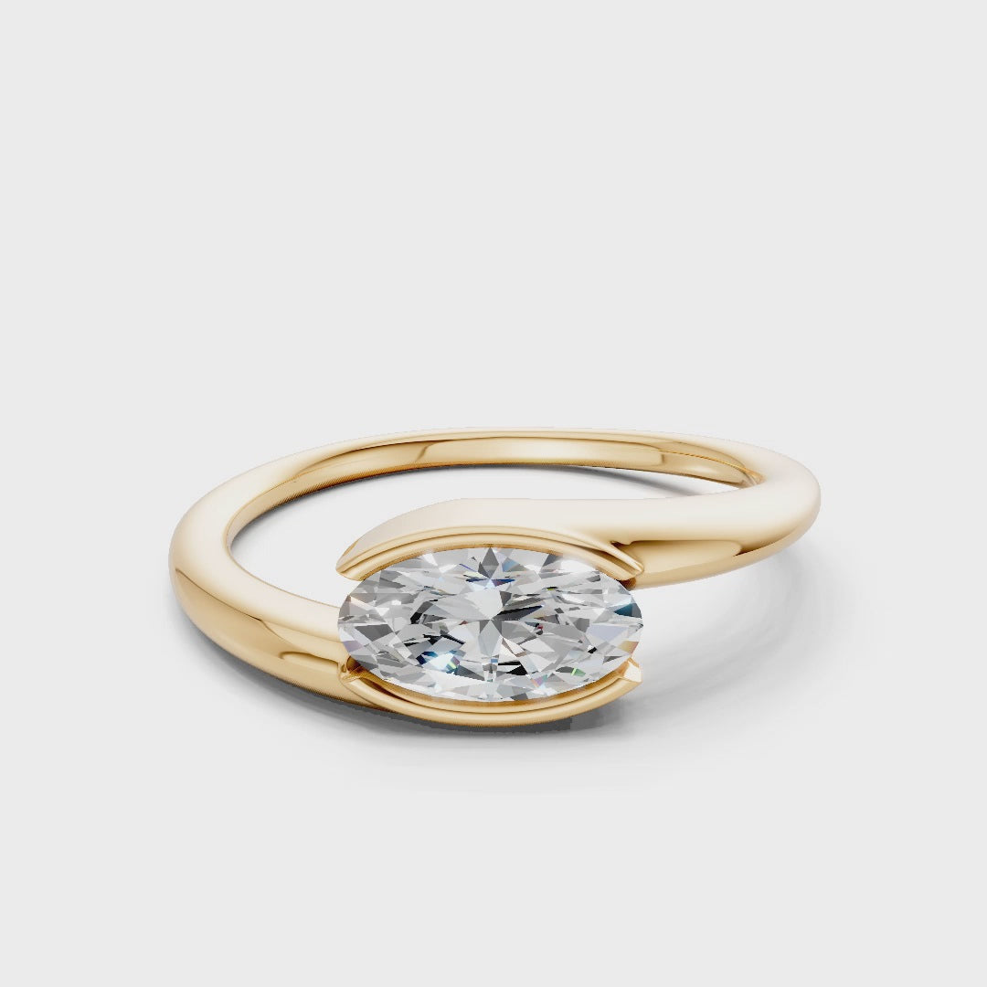 Rotating video showing the brilliance of the oval diamond and the polished finish of the yellow gold band in motion.