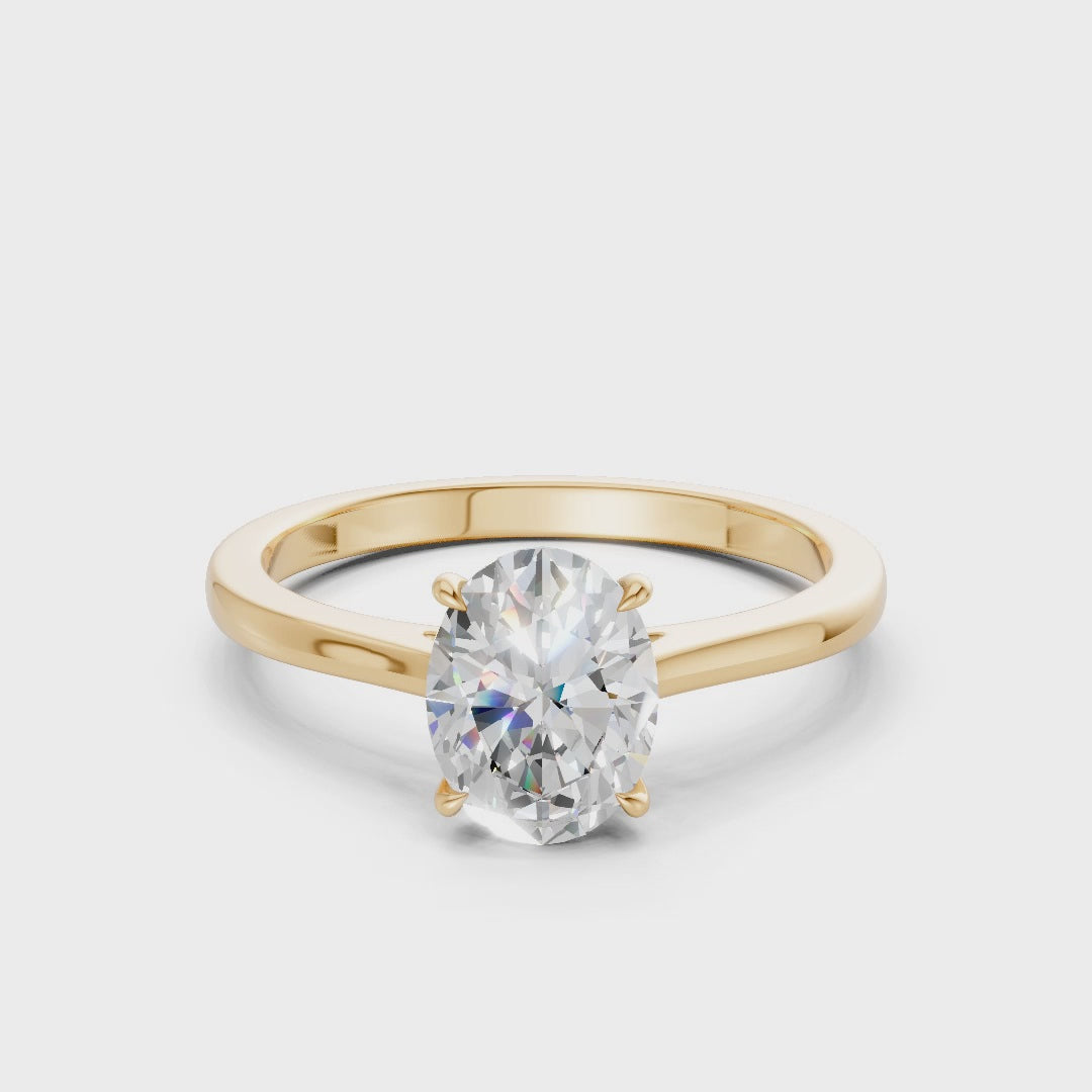 Rotating footage revealing every angle of the oval brilliance and the luminous flow of the yellow gold band.