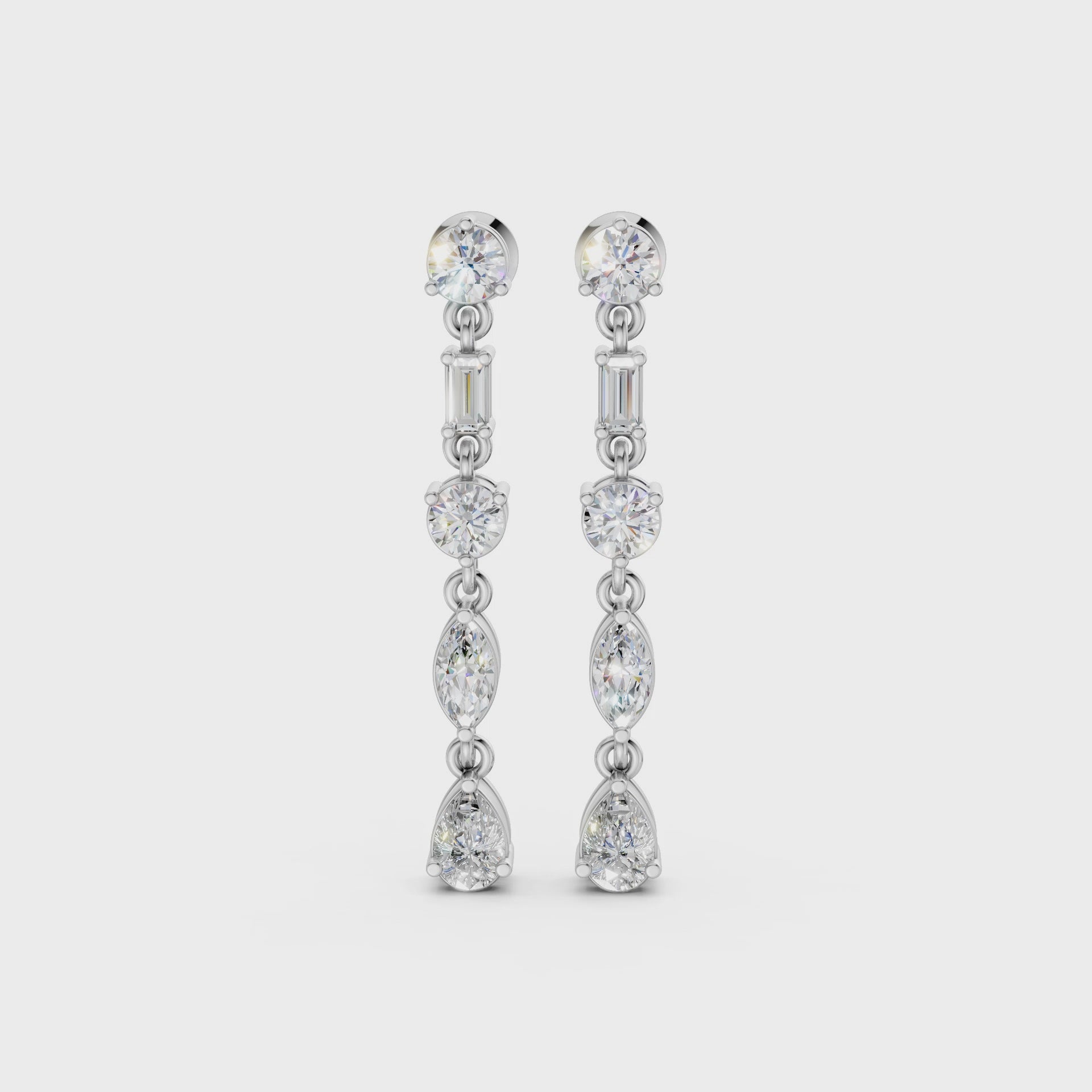 Short video of Linear Radiance Drop Earrings in 18K white gold, featuring 1.80 ct lab-grown diamonds, rotating to showcase the cool hue and sparkling refined motion.