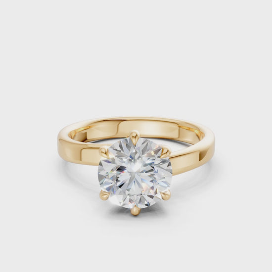 Smoothly rotating video capturing the powerful sparkle of the diamond and the radiant surface of the yellow gold setting.