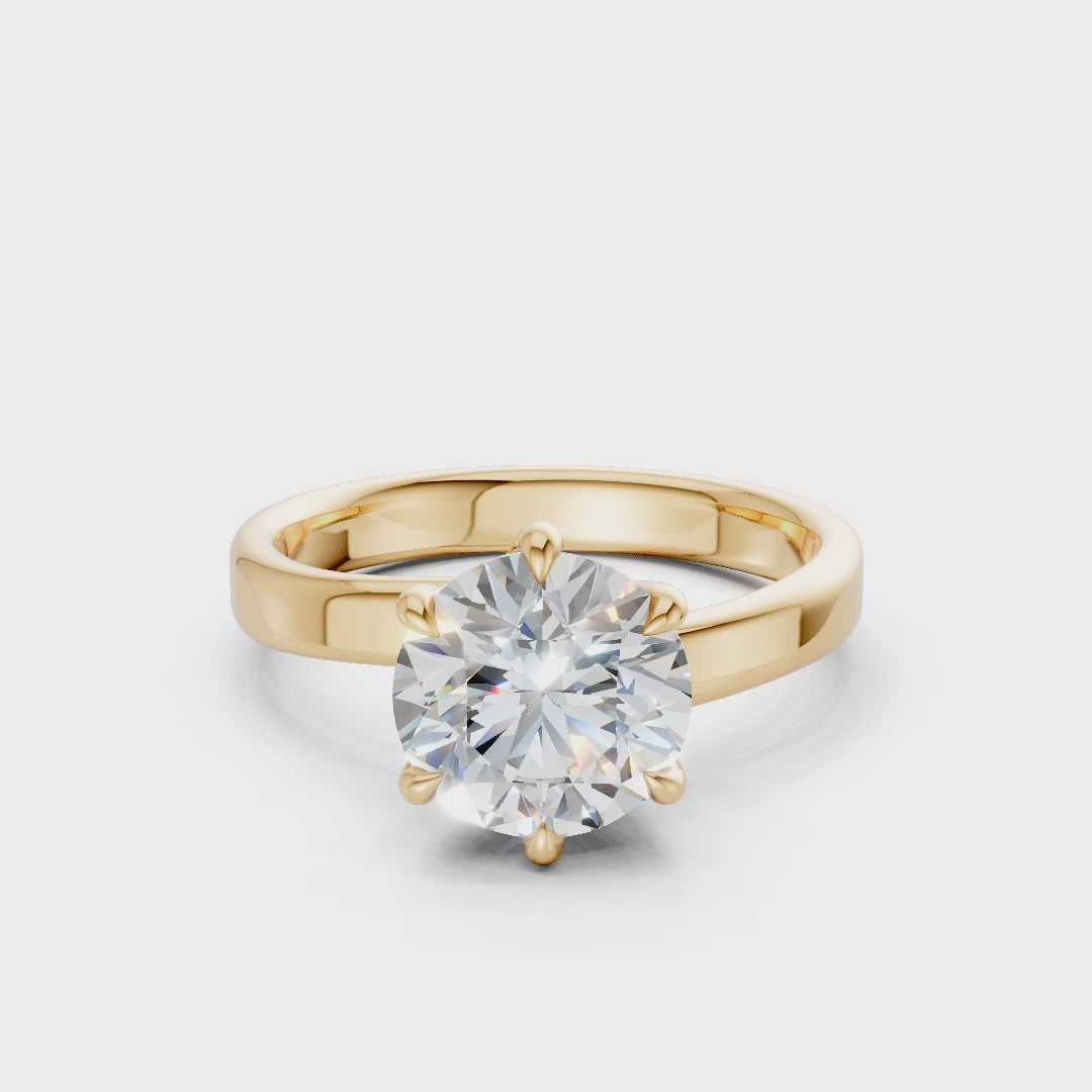 Smoothly rotating video capturing the powerful sparkle of the diamond and the radiant surface of the yellow gold setting.
