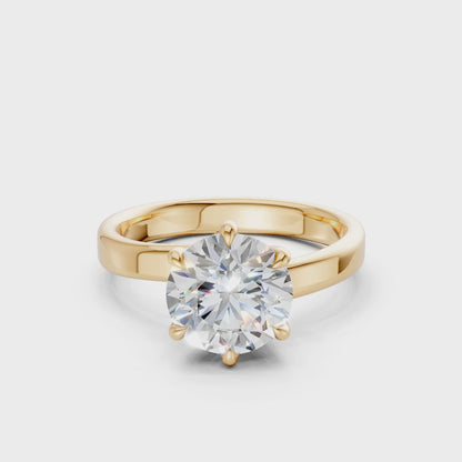 Smoothly rotating video capturing the powerful sparkle of the diamond and the radiant surface of the yellow gold setting.