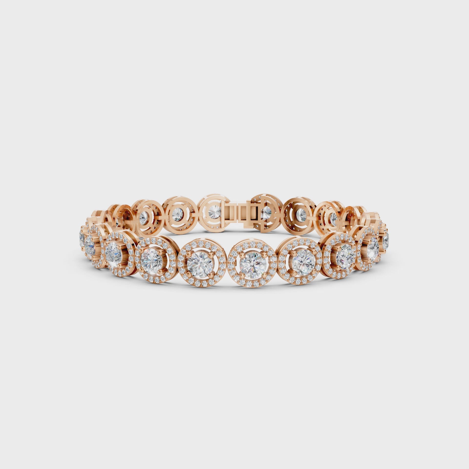 360° rotating video capturing the layered sparkle of each diamond halo and the rosy gleam of the gold.