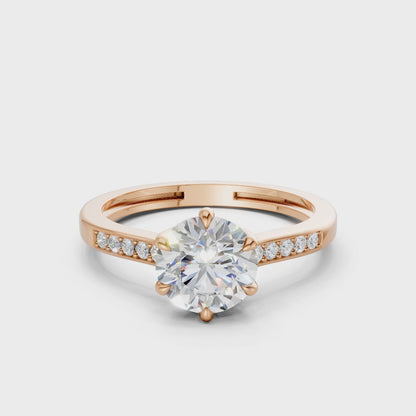 360° rotating video capturing the clean facets of the princess cut and the radiant polish of the rose gold band.
