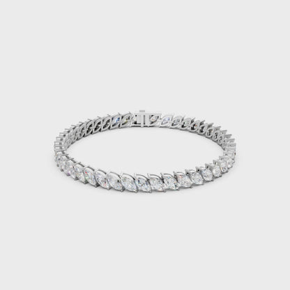 Smooth rotating clip capturing the interplay of fire and reflection between marquise facets and polished white gold.