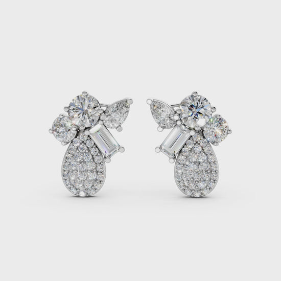 Short video of Modern Teardrop Cluster Diamond Earrings in 18K white gold, featuring 2.368 ct lab-grown diamonds, rotating to showcase the cool hue and sparkling teardrop cluster.