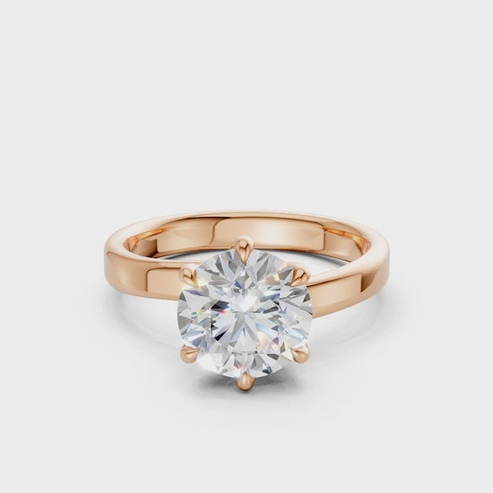 360° rotating video capturing the diamond’s fiery facets and the romantic luster of the rose gold setting.