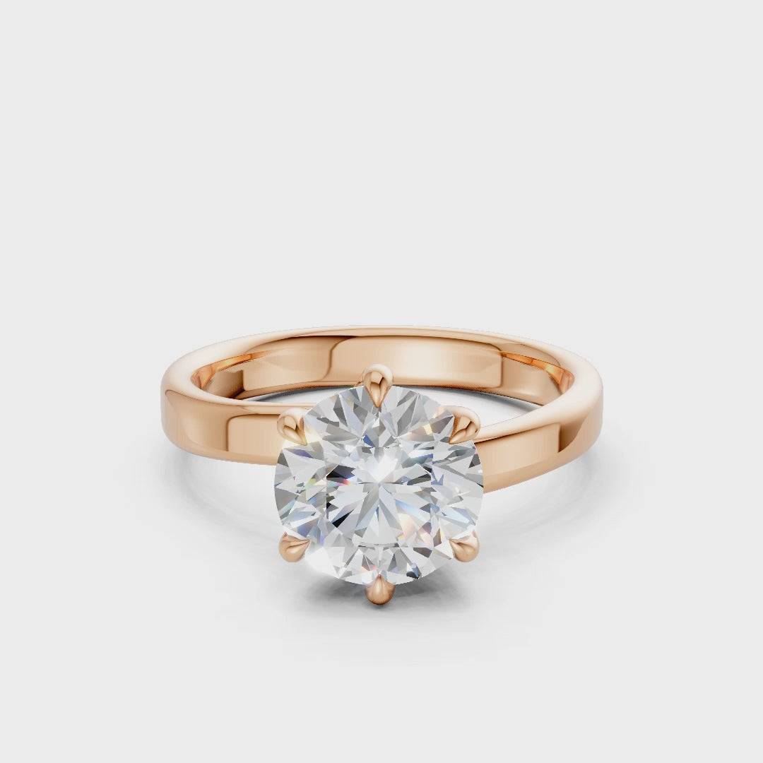 360° rotating video capturing the diamond’s fiery facets and the romantic luster of the rose gold setting.